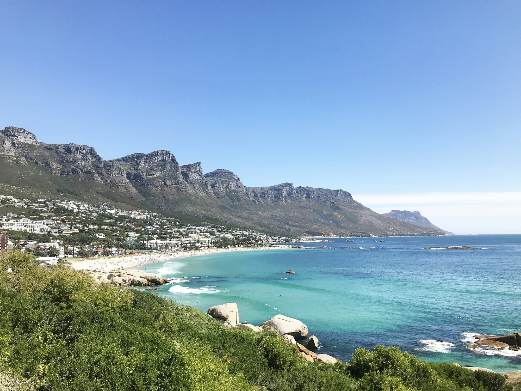 Camps Bay beach and the Twelve Apostles mountain range along the Cape Town coastline
