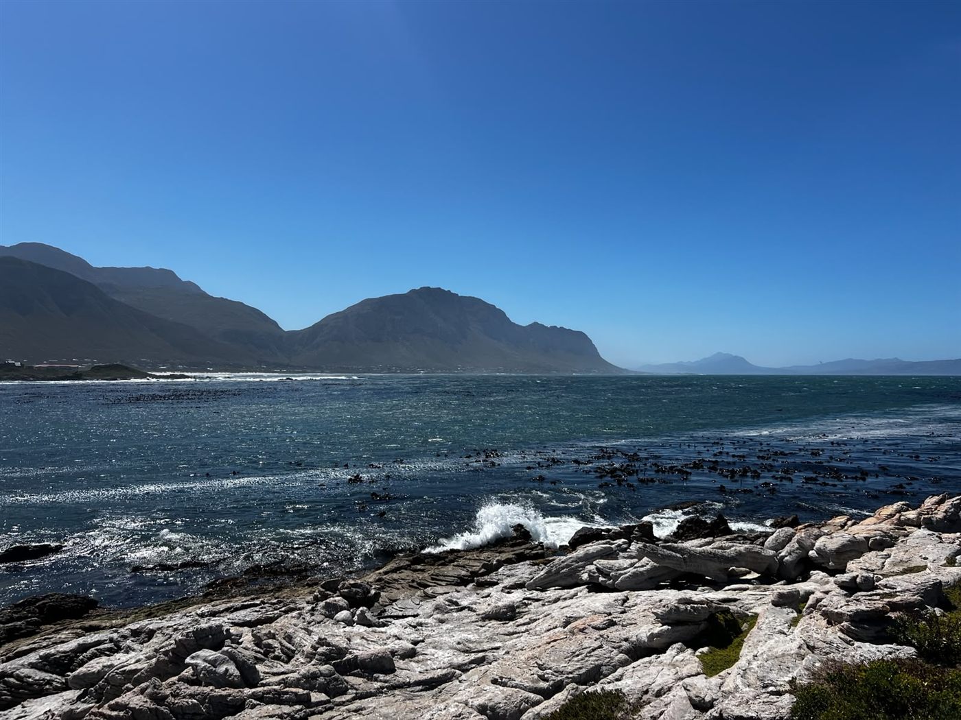 A wild stretch of South African coastline meeting the sea
