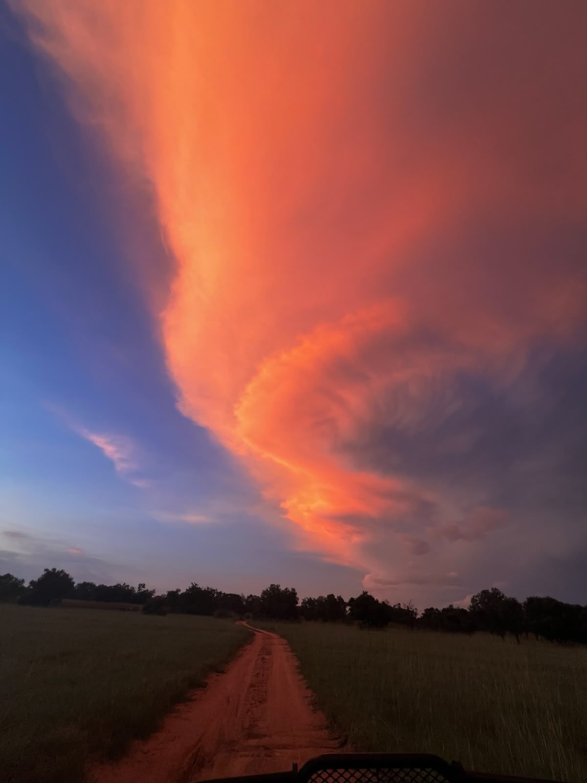 A dramatic red sky at dusk over the landscape